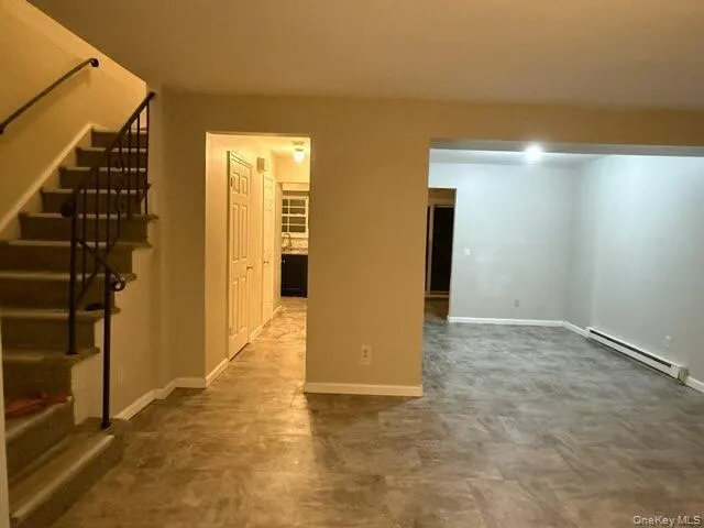 a view of an empty room with stairs