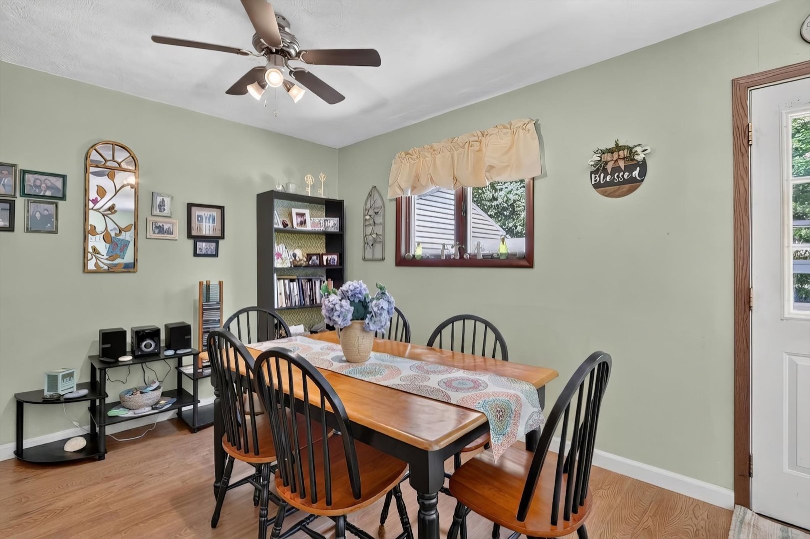 1204 West Violet Street Freeport, IL 61032 - Photo 13 of 36 a view of a a dining room with furniture window and wooden floor