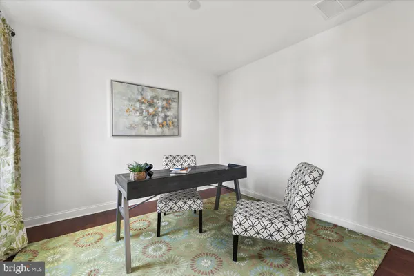 a kitchen with large table and chairs