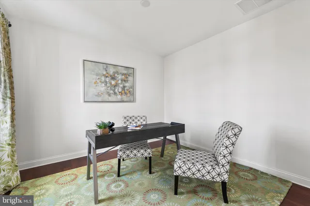 a kitchen with large table and chairs