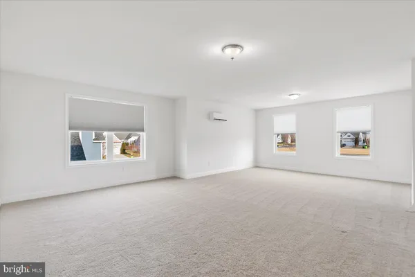 a view of an empty room with a closet