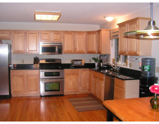 40 Scenic Road Westfield, MA 01085 - Photo 2 of 14 a kitchen with stainless steel appliances a stove sink microwave and cabinets