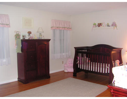 40 Scenic Road Westfield, MA 01085 - Photo 8 of 14 a bedroom with a bed and wooden floor
