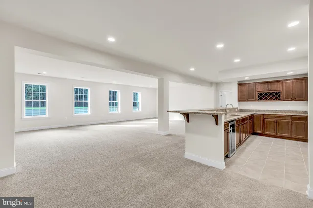 a bathroom with a granite countertop sink mirror and double