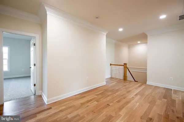 a view of kitchen with stainless steel appliances granite countertop a stove top oven a sink a dining table and chairs