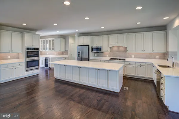 a view of a livingroom with furniture fireplace and wooden floor