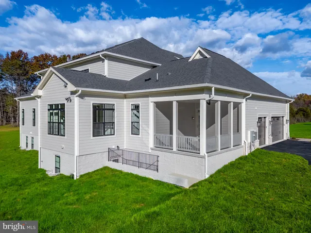 a view of house with yard