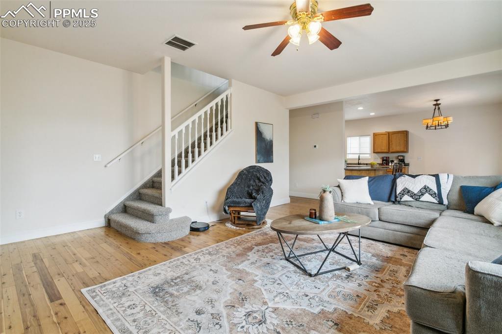 12229 Crystal Downs Road Peyton, CO 80831 - Photo 14 of 47 a living room with furniture and a rug