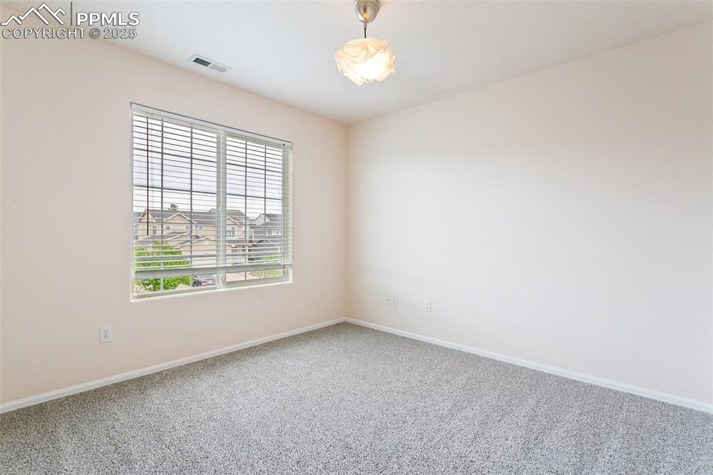 12229 Crystal Downs Road Peyton, CO 80831 - Photo 34 of 47 an empty room with a window