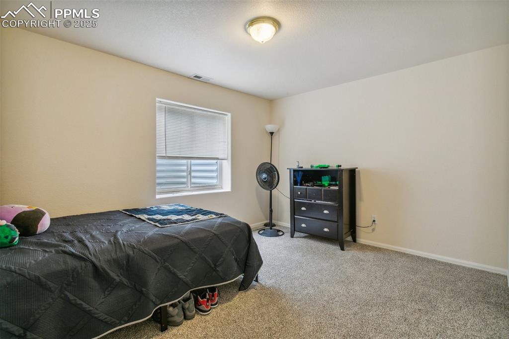 12229 Crystal Downs Road Peyton, CO 80831 - Photo 42 of 47 a bedroom with a bed and a closet