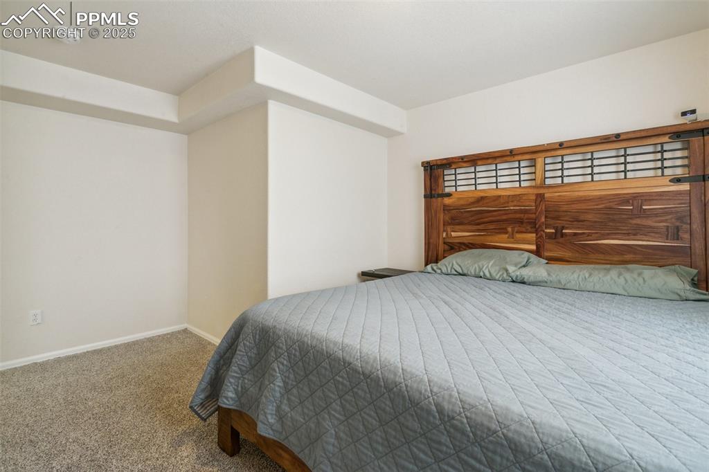 12229 Crystal Downs Road Peyton, CO 80831 - Photo 43 of 47 a bedroom with a bed and a window