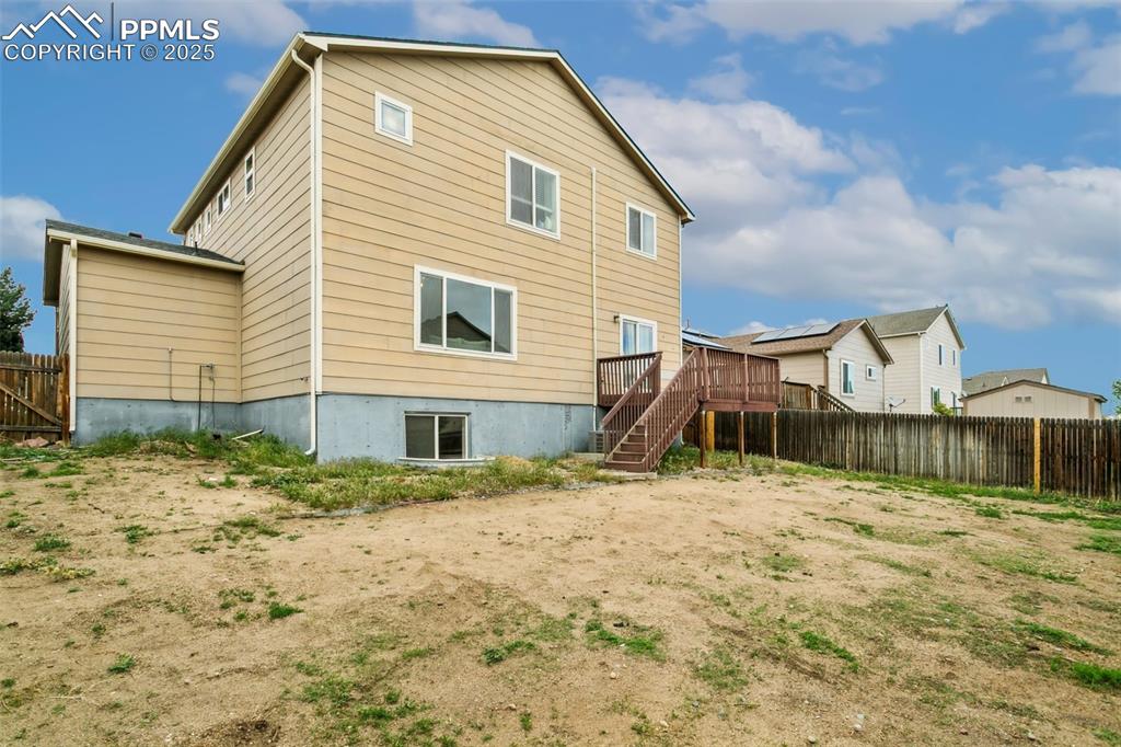 12229 Crystal Downs Road Peyton, CO 80831 - Photo 47 of 47 a view of a house with a yard