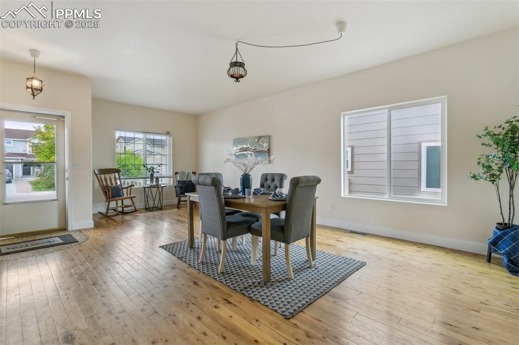 12229 Crystal Downs Road Peyton, CO 80831 - Photo 7 of 47 a living room with furniture and wooden floor