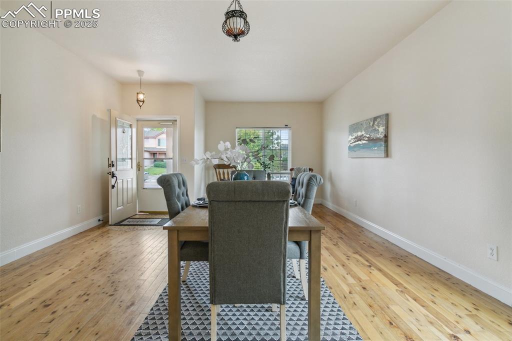 12229 Crystal Downs Road Peyton, CO 80831 - Photo 8 of 47 a view of a dining room with furniture and a window