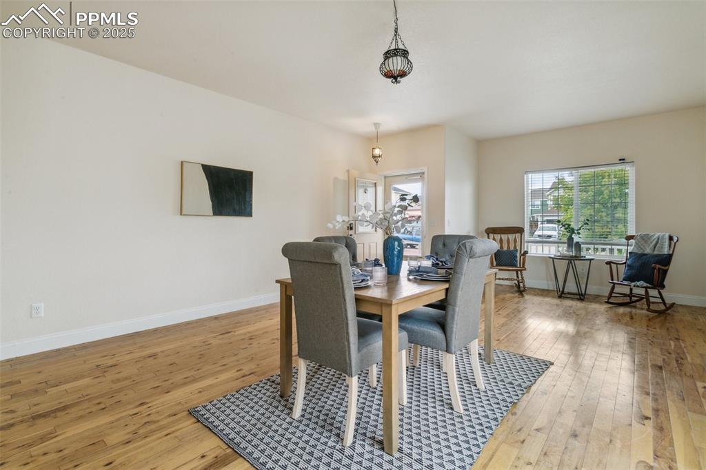 12229 Crystal Downs Road Peyton, CO 80831 - Photo 9 of 47 a view of a dining room with furniture