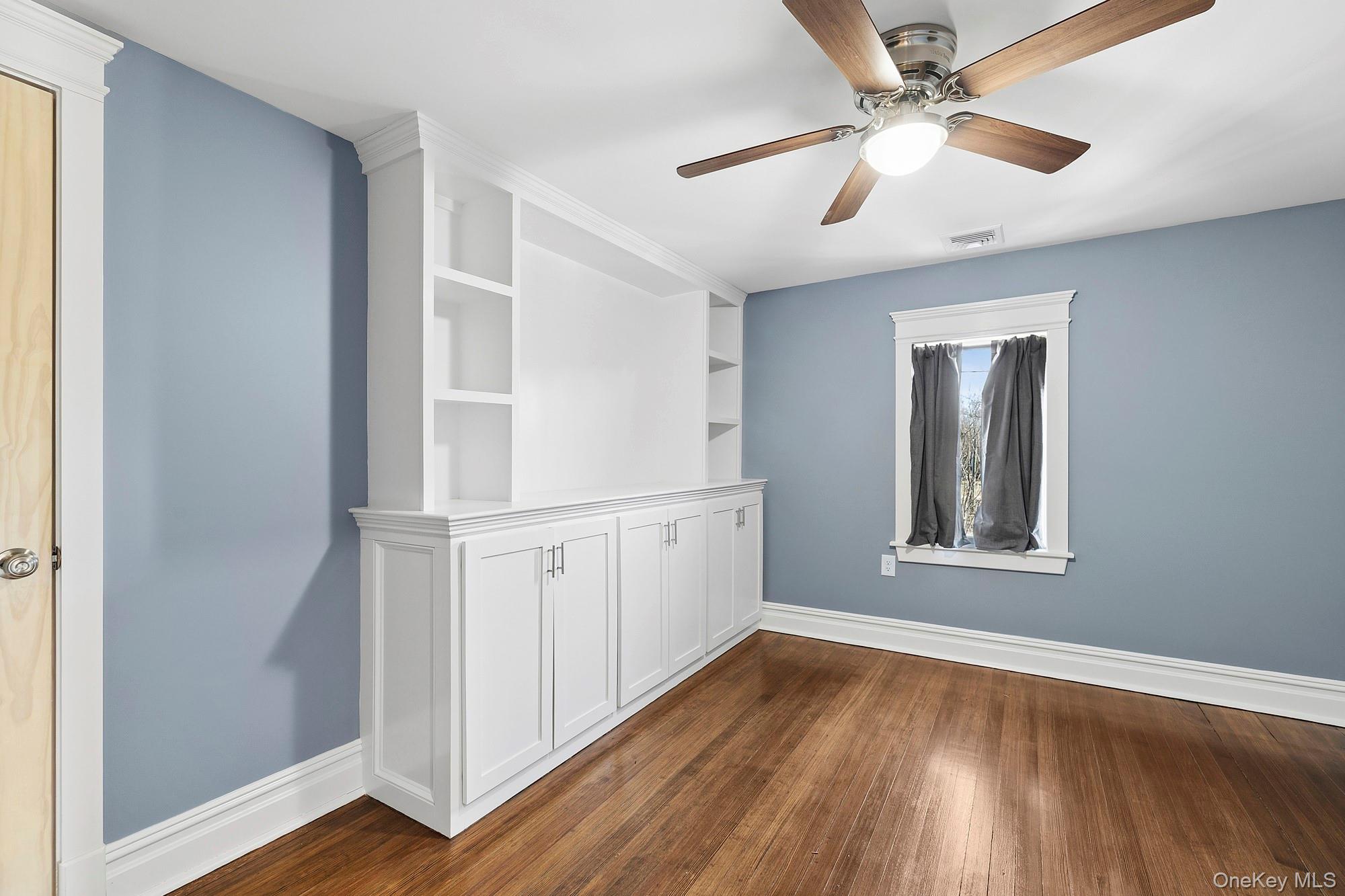 178 Main Road Riverhead, NY 11901 - Photo 22 of 28 wooden floor in an empty room with a window