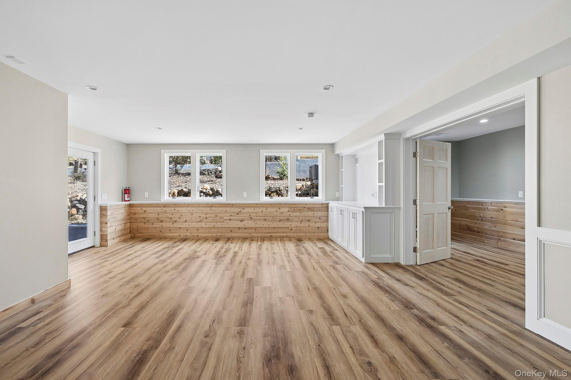 178 Main Road Riverhead, NY 11901 - Photo 25 of 28 a view of an empty room with wooden floor and a window