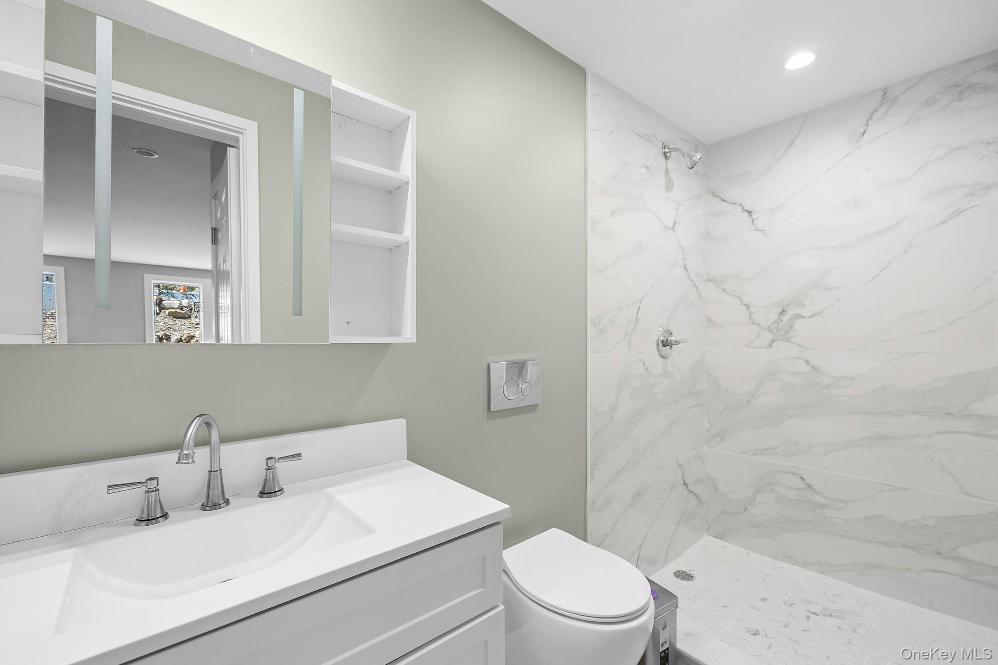 178 Main Road Riverhead, NY 11901 - Photo 26 of 28 a bathroom with a sink toilet and shower