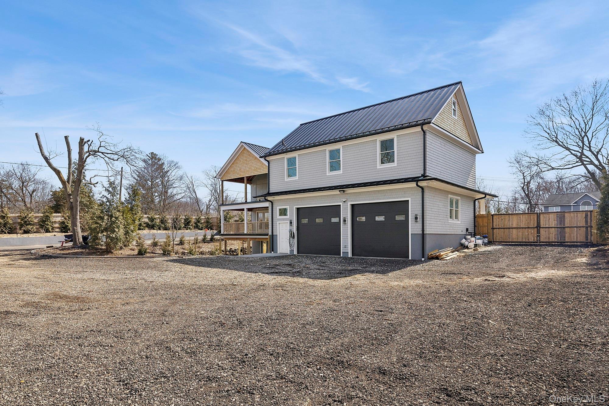 178 Main Road Riverhead, NY 11901 - Photo 4 of 28 a view of a house with a yard and large tree