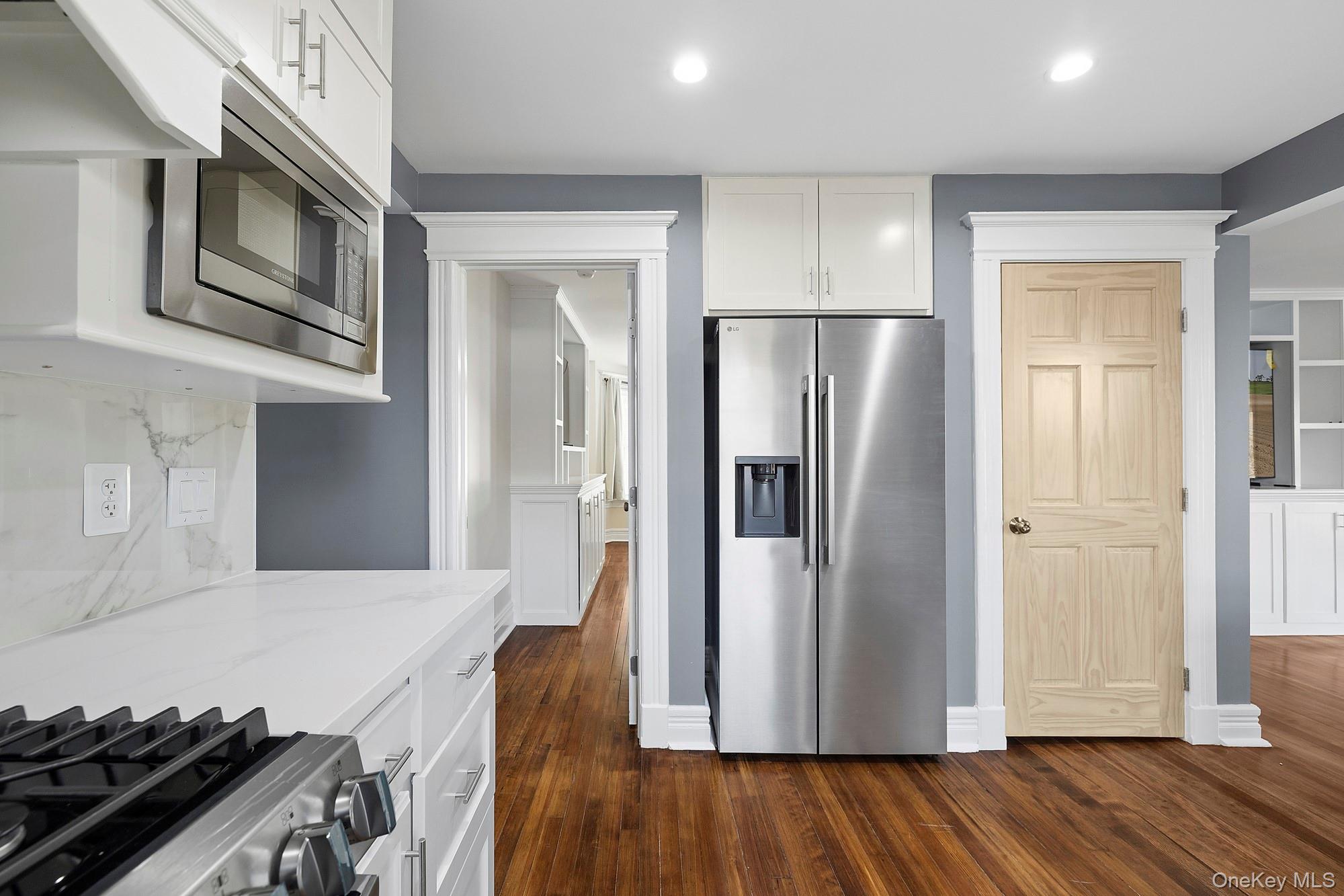 178 Main Road Riverhead, NY 11901 - Photo 8 of 28 a kitchen with stainless steel appliances granite countertop a refrigerator and a stove