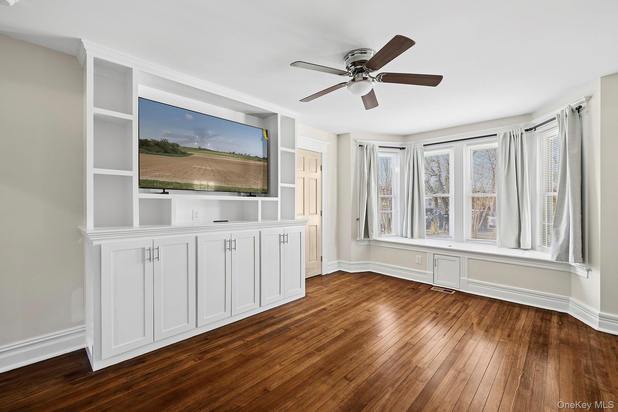 178 Main Road Riverhead, NY 11901 - Photo 9 of 28 a view of livingroom with furniture wooden floor and window