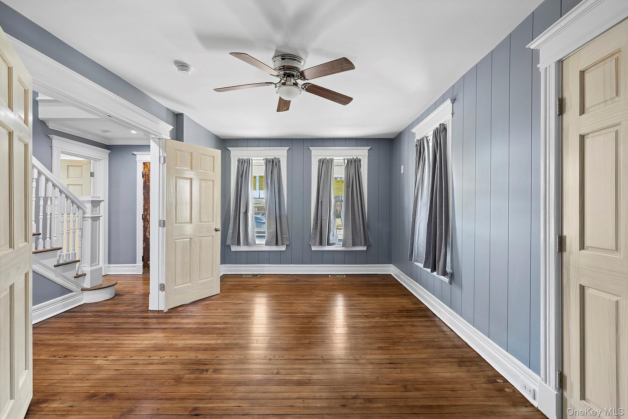 178 Main Road Riverhead, NY 11901 - Photo 10 of 28 a view of an empty room with wooden floor and a window