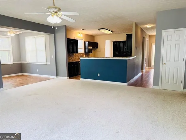 a view of a kitchen with furniture and a window
