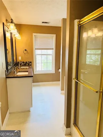 a bathroom with a tub and a shower