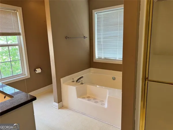 a bathroom with double sink and a mirror