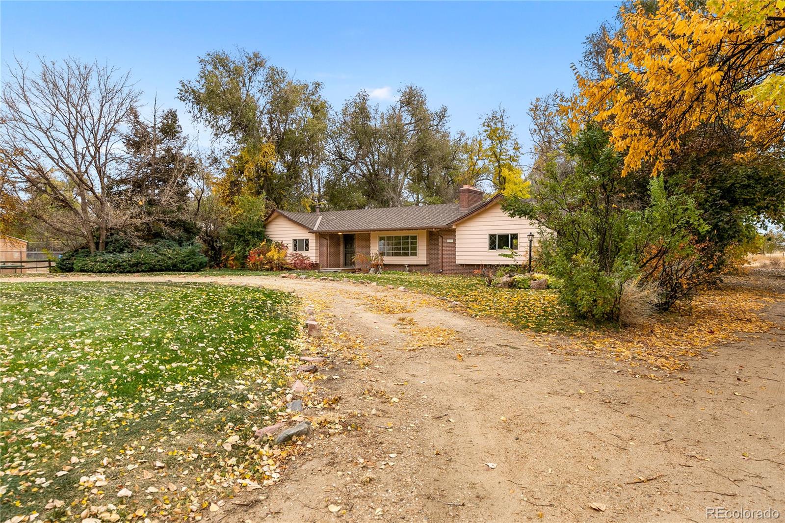 12590 Jay Road Erie, CO 80516 - Photo 3 of 25 a house with trees in the background