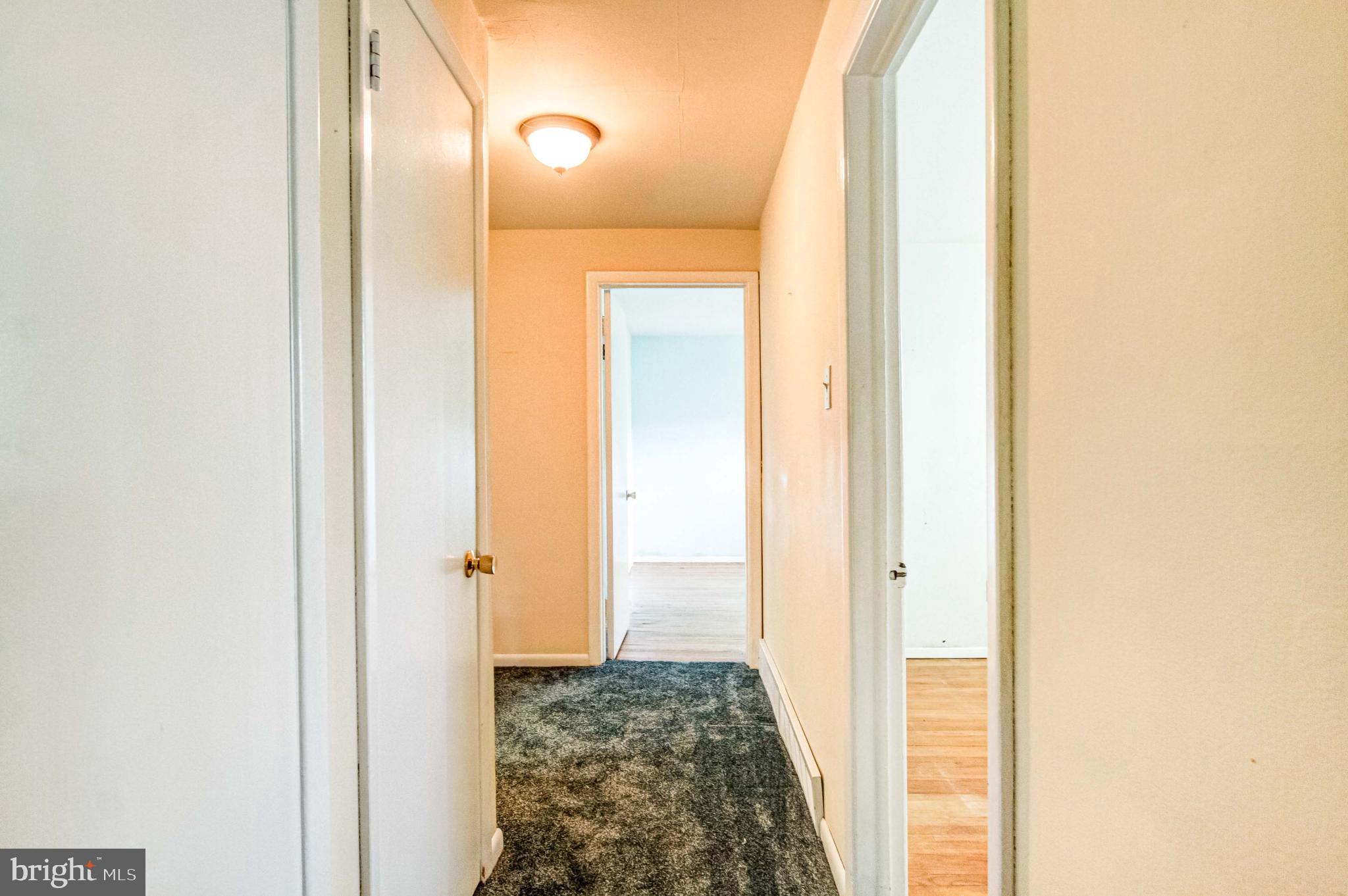 23 Rampart West Media, PA 19063 - Photo 13 of 35 Inviting hallway with warm, natural light.