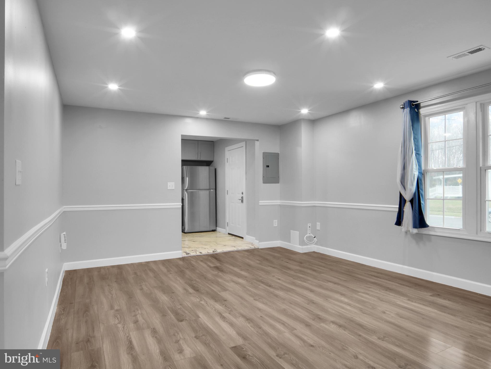 125 Valley Road Aberdeen, MD 21001 - Photo 14 of 24 an empty room with wooden floor and windows