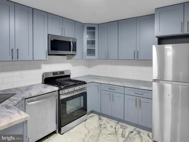 a kitchen with a stove and a microwave