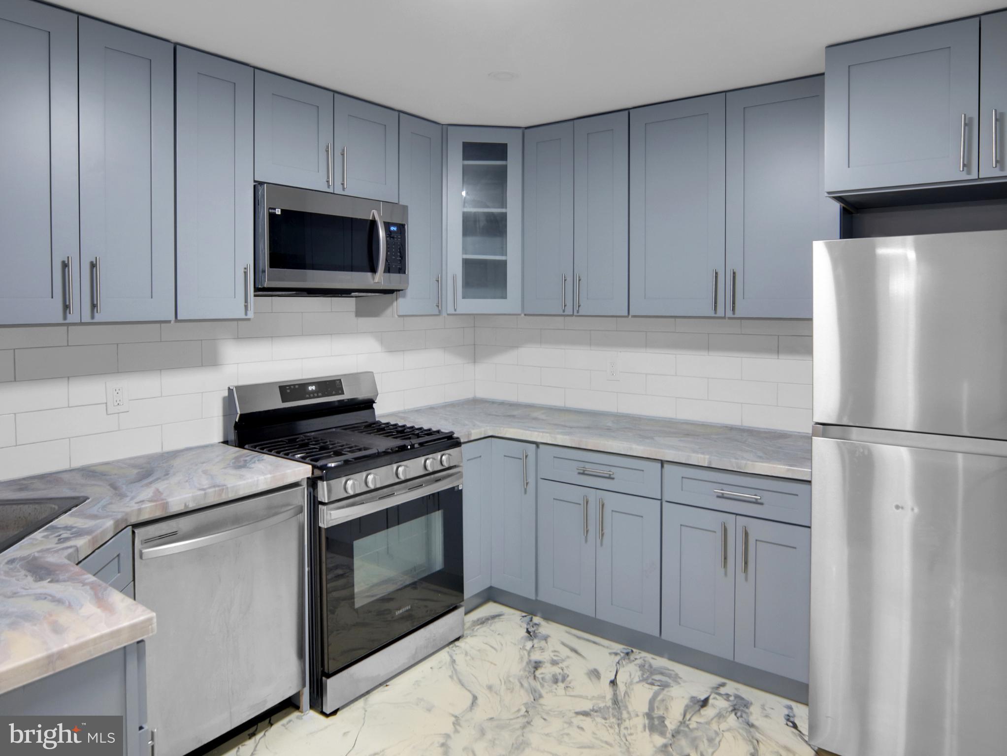 125 Valley Road Aberdeen, MD 21001 - Photo 17 of 24 a kitchen with a stove and a microwave