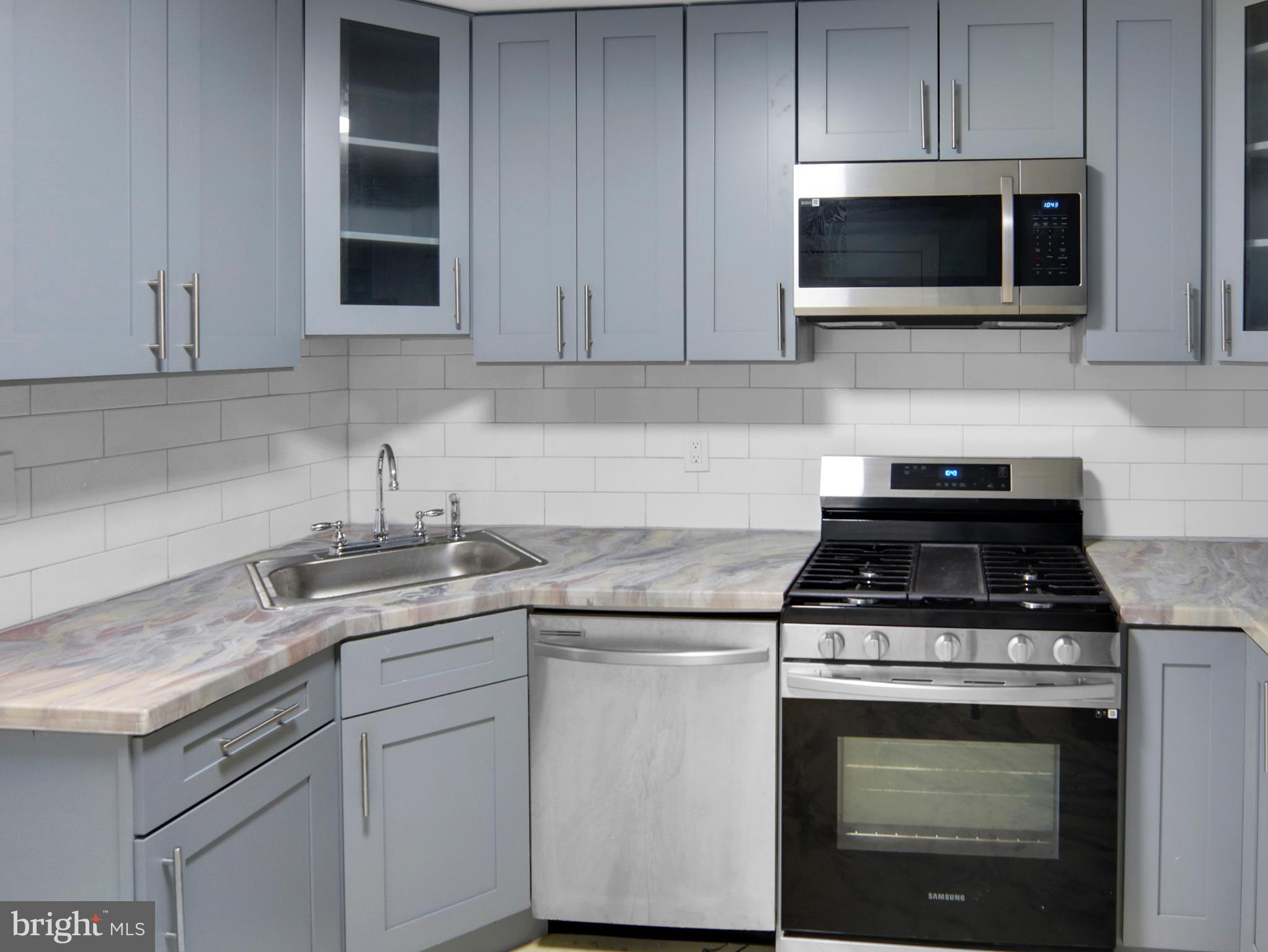 125 Valley Road Aberdeen, MD 21001 - Photo 18 of 24 a kitchen with cabinets stainless steel appliances and a sink