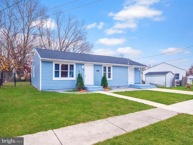 a house view with a sitting space and garden