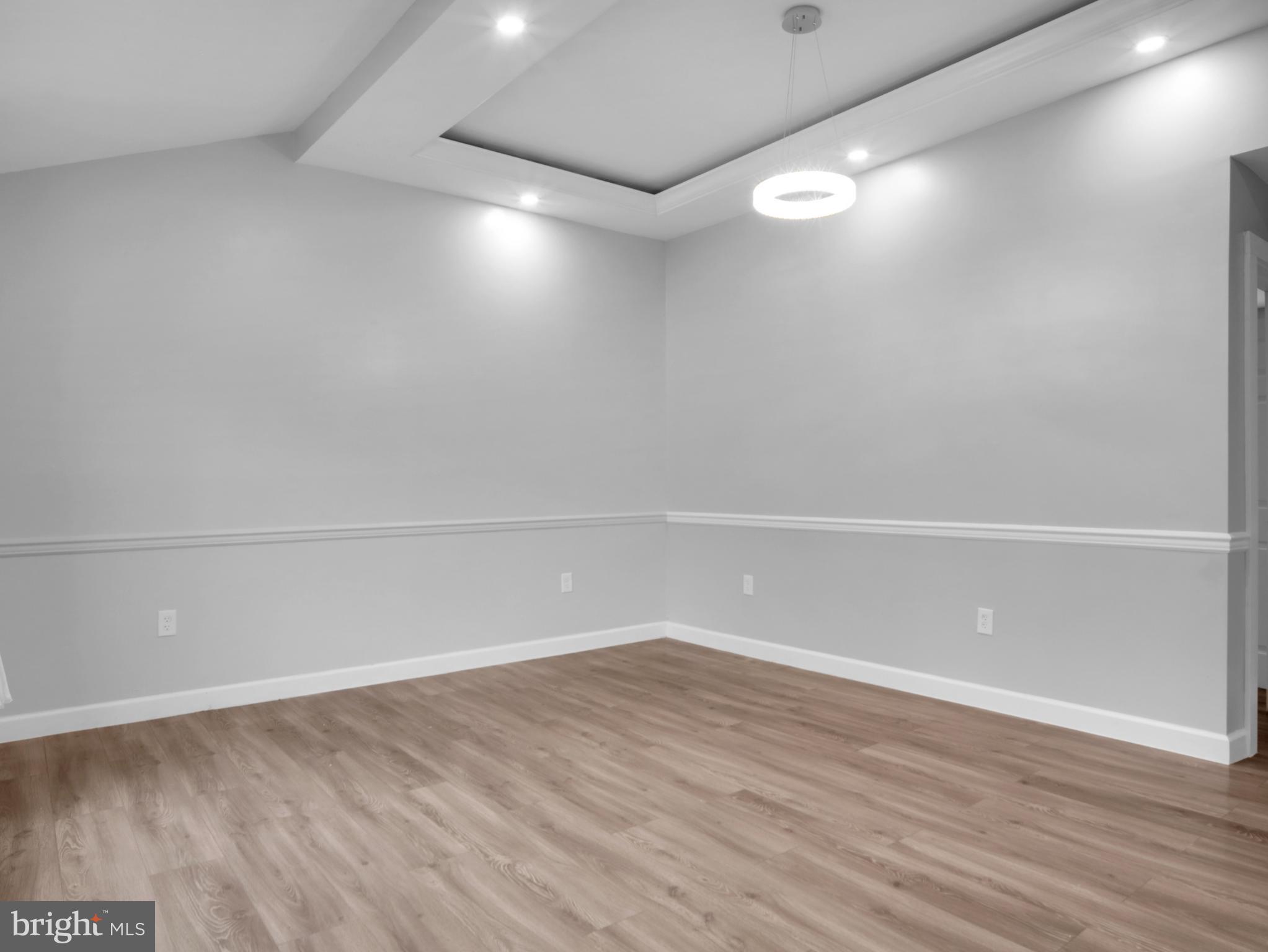 125 Valley Road Aberdeen, MD 21001 - Photo 9 of 24 a view of an empty room with wooden floor and white walls