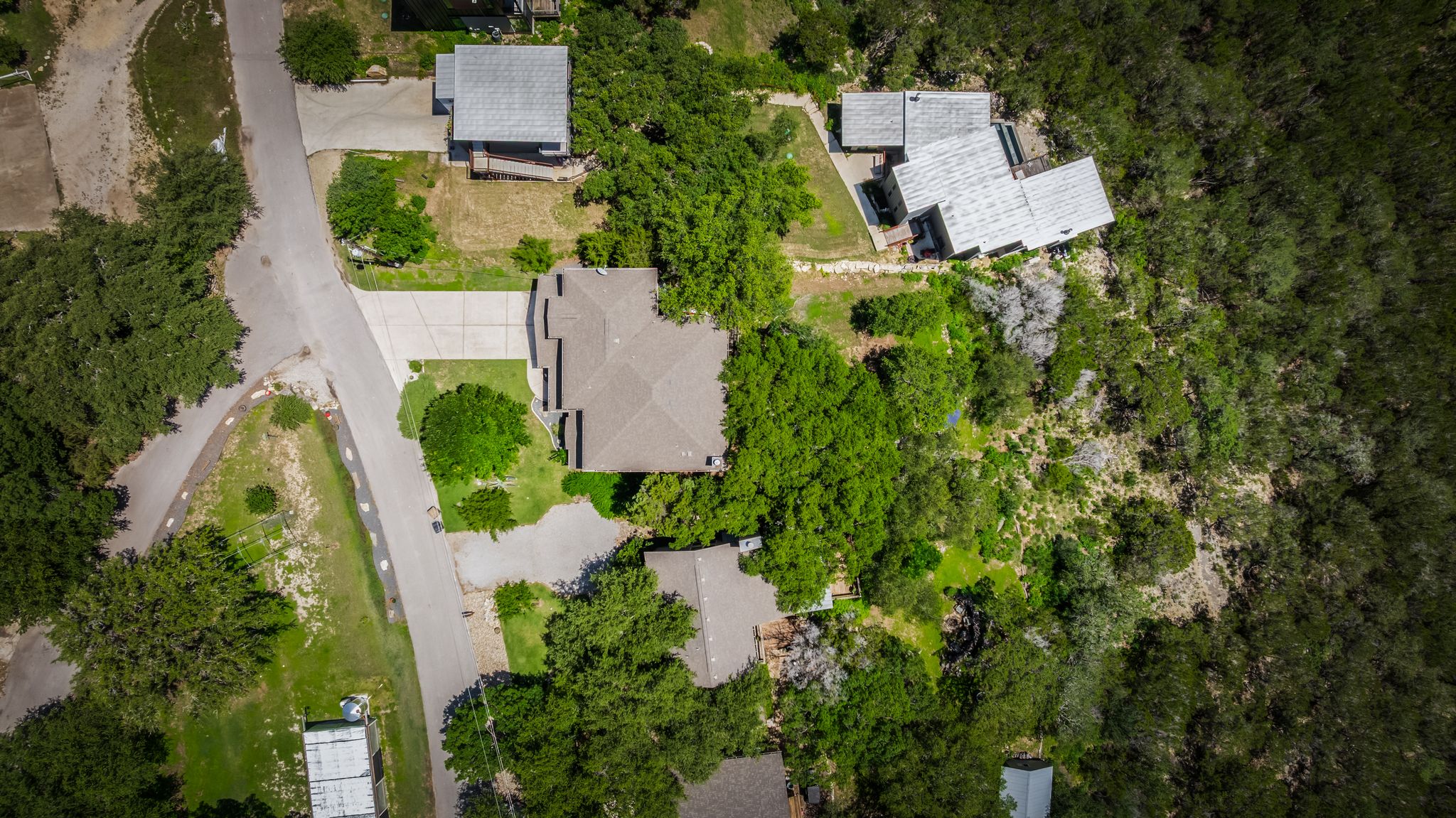 14213 Red Feather Trail Austin, TX 78734 - Photo 37 of 39 an aerial view of a house with a yard and lake view