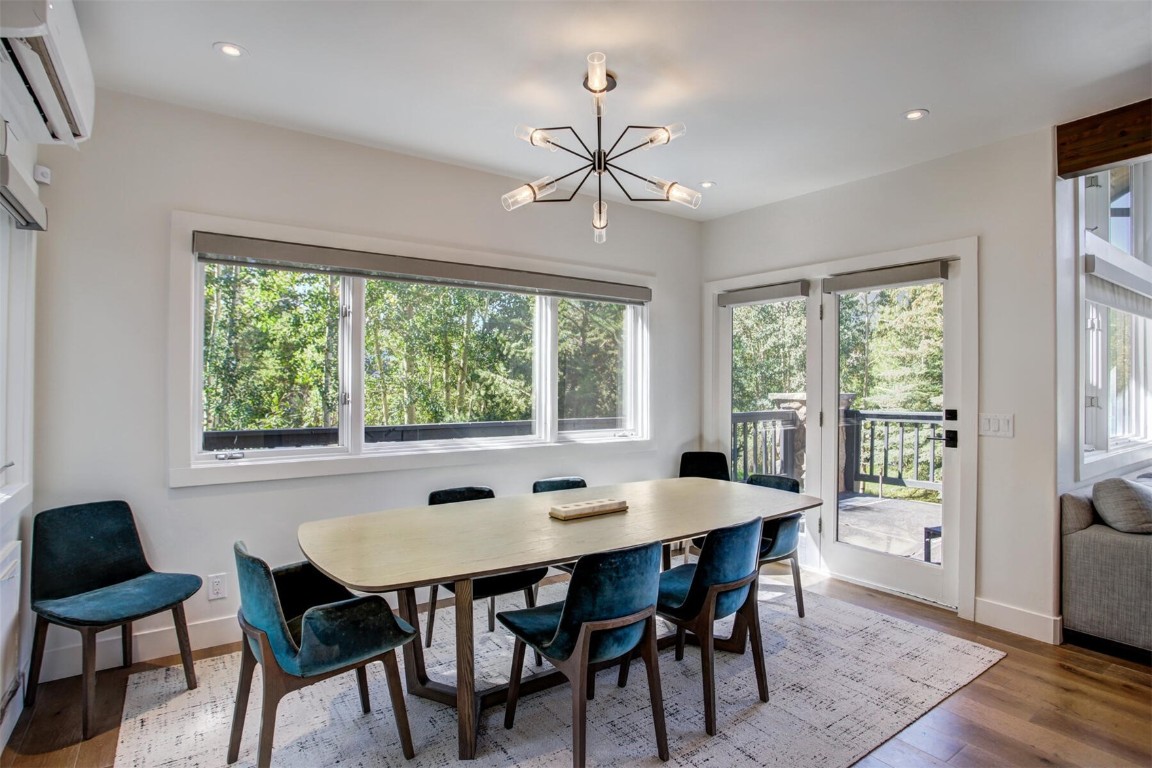 203 Wellington Road Breckenridge, CO 80424 - Photo 11 of 42 a dining room with furniture window and wooden floor