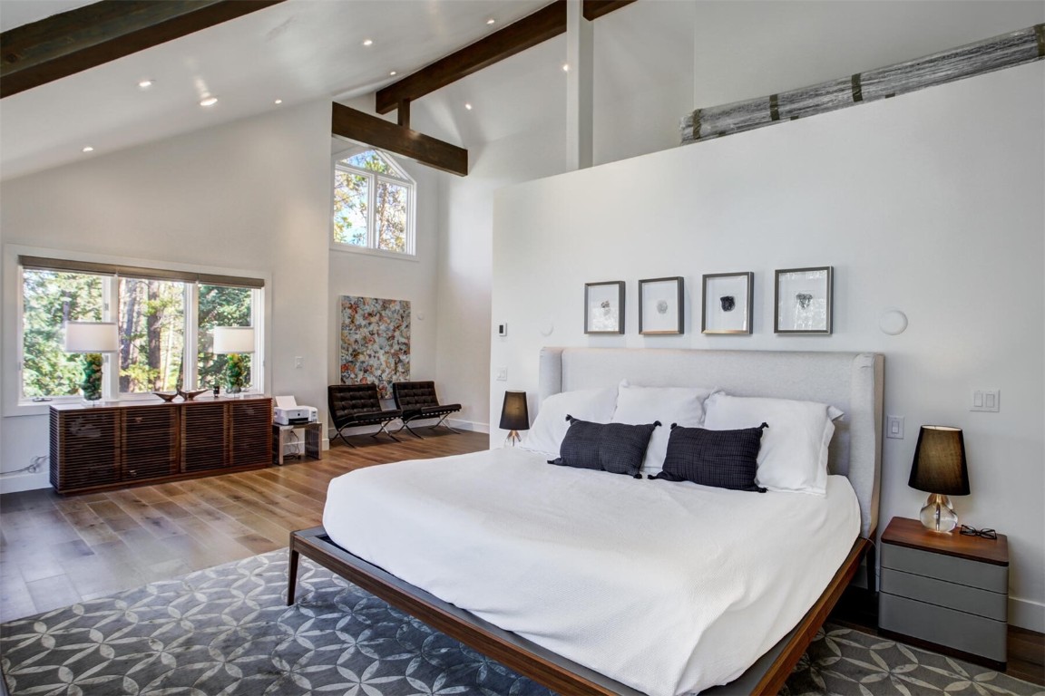 203 Wellington Road Breckenridge, CO 80424 - Photo 17 of 42 a bedroom with a large bed and a large window