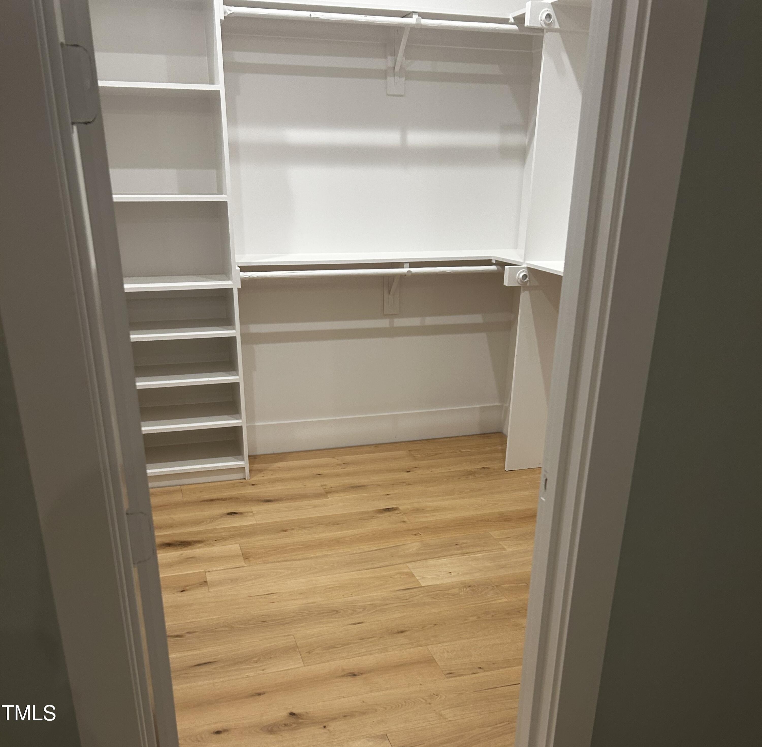 1008 Frank Bailey Road Wake Forest, NC 27587 - Photo 13 of 22 a view of walk in closet with empty racks