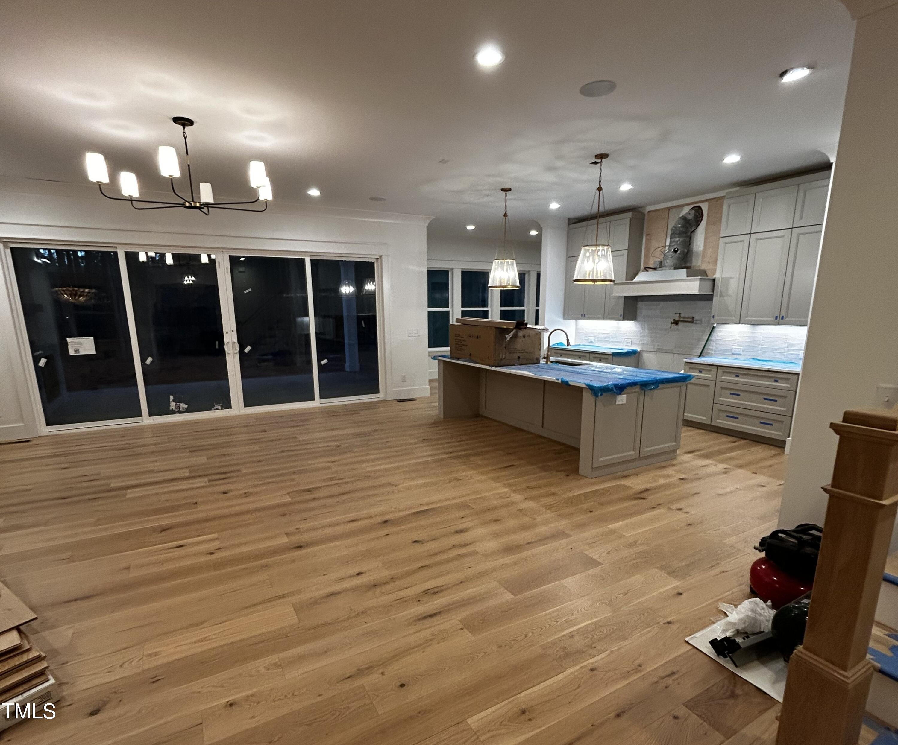 1008 Frank Bailey Road Wake Forest, NC 27587 - Photo 3 of 22 a view of kitchen with kitchen island stainless steel appliances refrigerator stove microwave and furniture