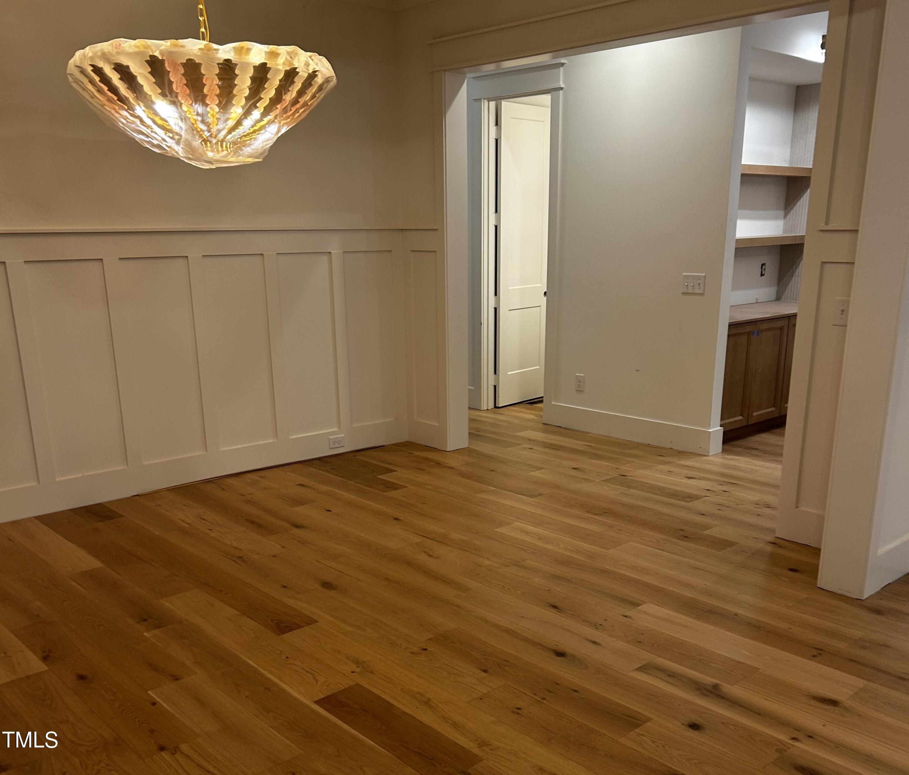 1008 Frank Bailey Road Wake Forest, NC 27587 - Photo 7 of 22 a view of an empty room with wooden floor