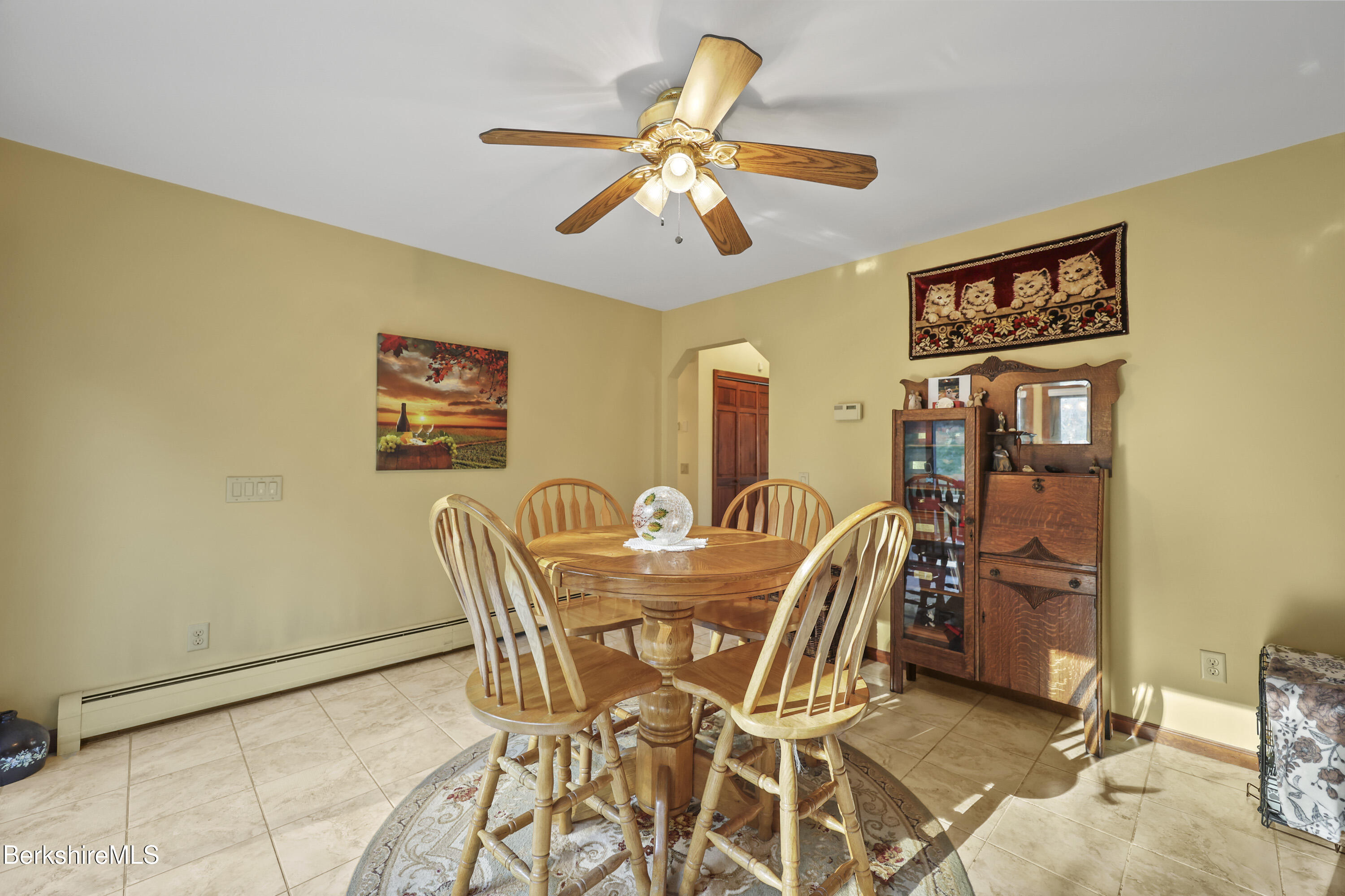 551 Tamarack Road Pittsfield, MA 01201 - Photo 14 of 51 a view of a dining room with furniture and chandelier fan