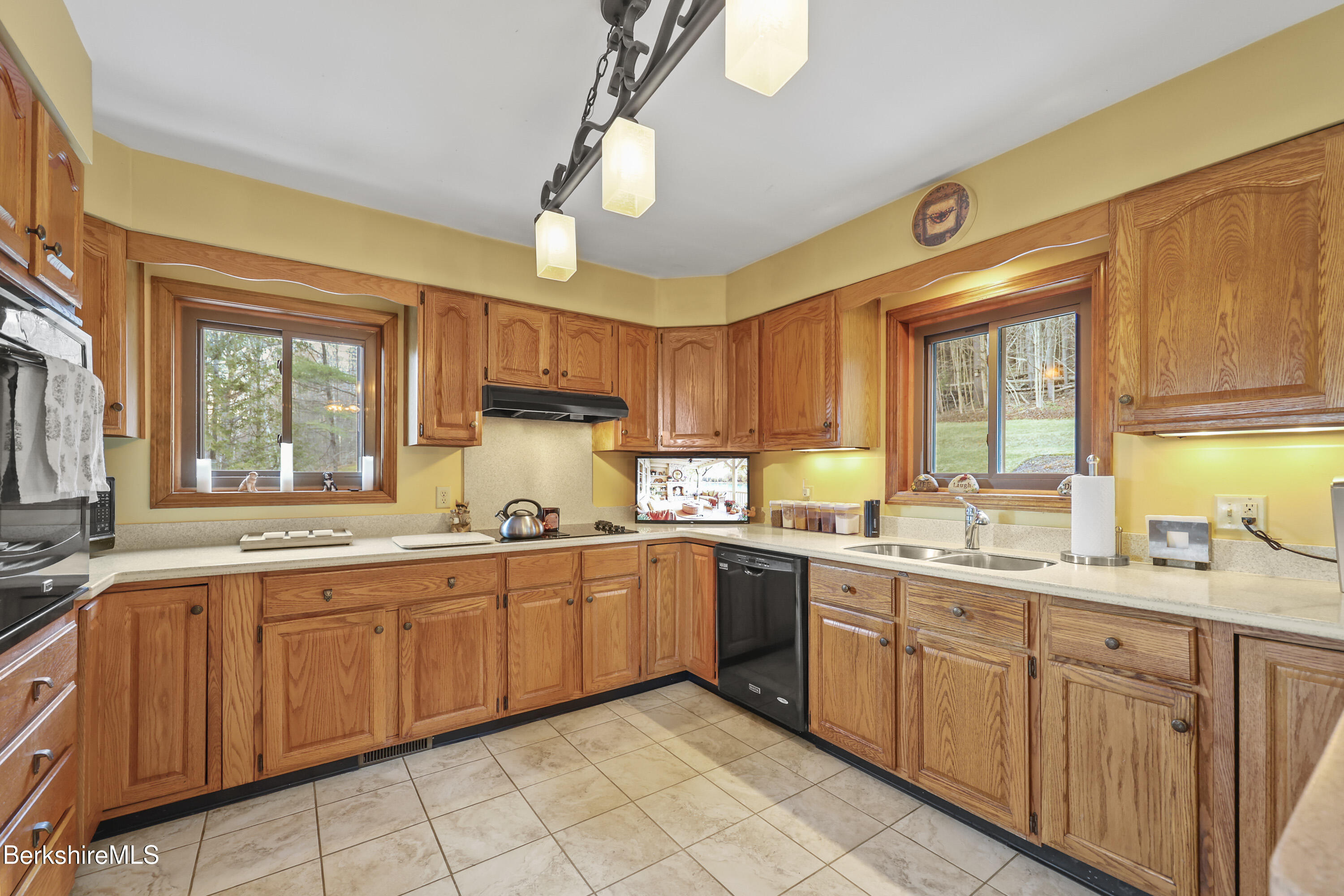 551 Tamarack Road Pittsfield, MA 01201 - Photo 17 of 51 a large kitchen with a large window appliances and cabinets