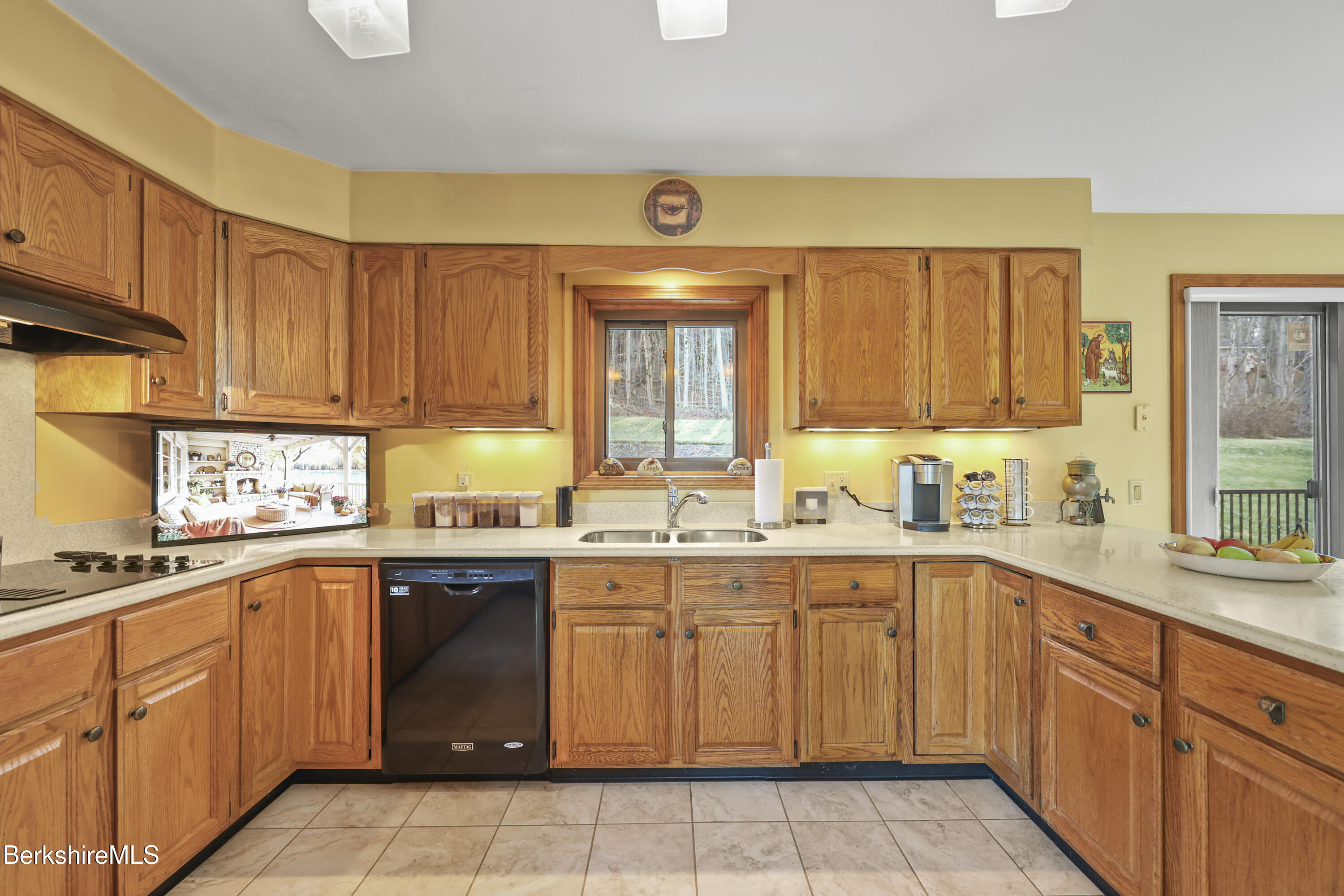 551 Tamarack Road Pittsfield, MA 01201 - Photo 18 of 51 a kitchen with a sink stove top oven and cabinets