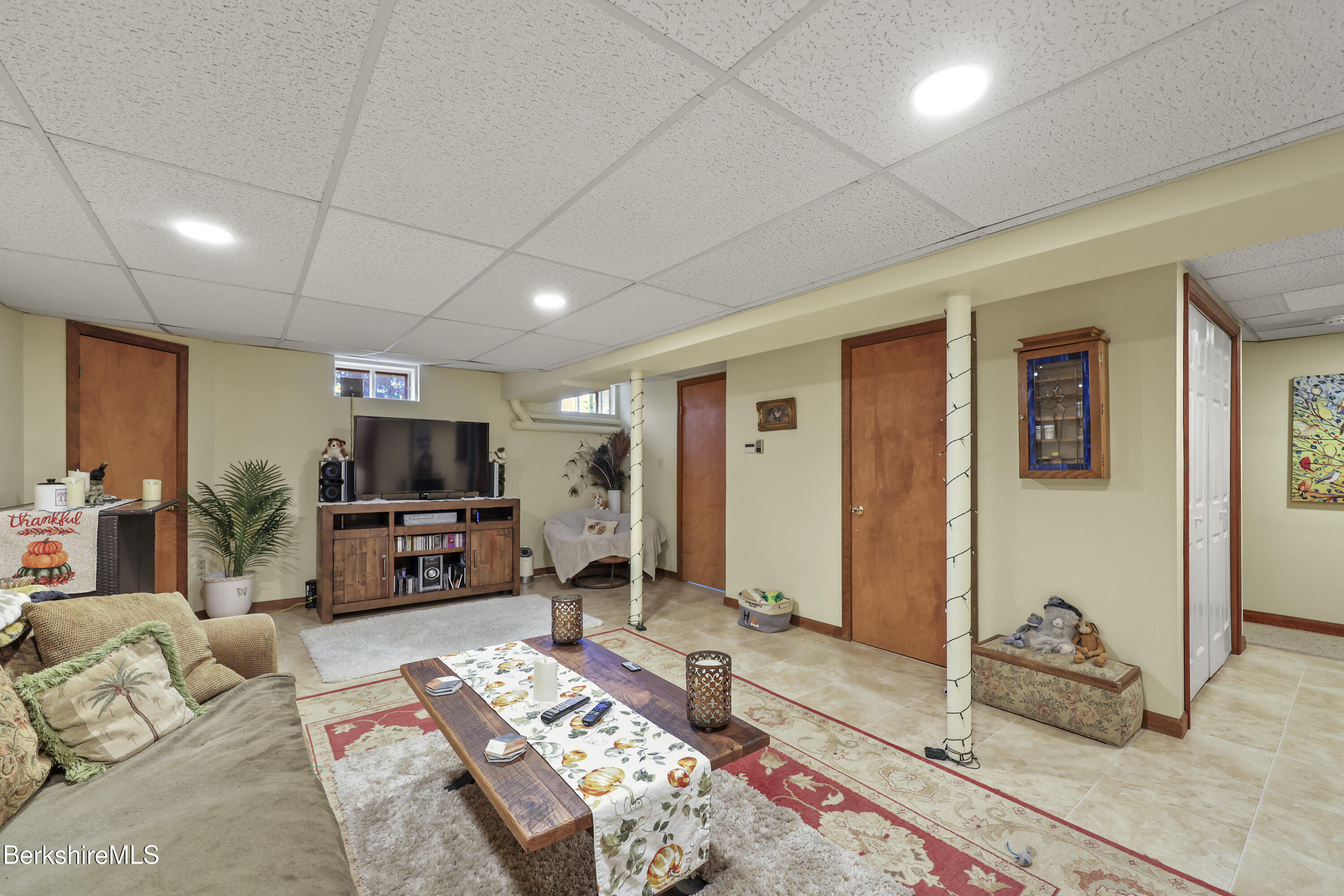 551 Tamarack Road Pittsfield, MA 01201 - Photo 35 of 51 a bedroom with furniture and a flat screen tv