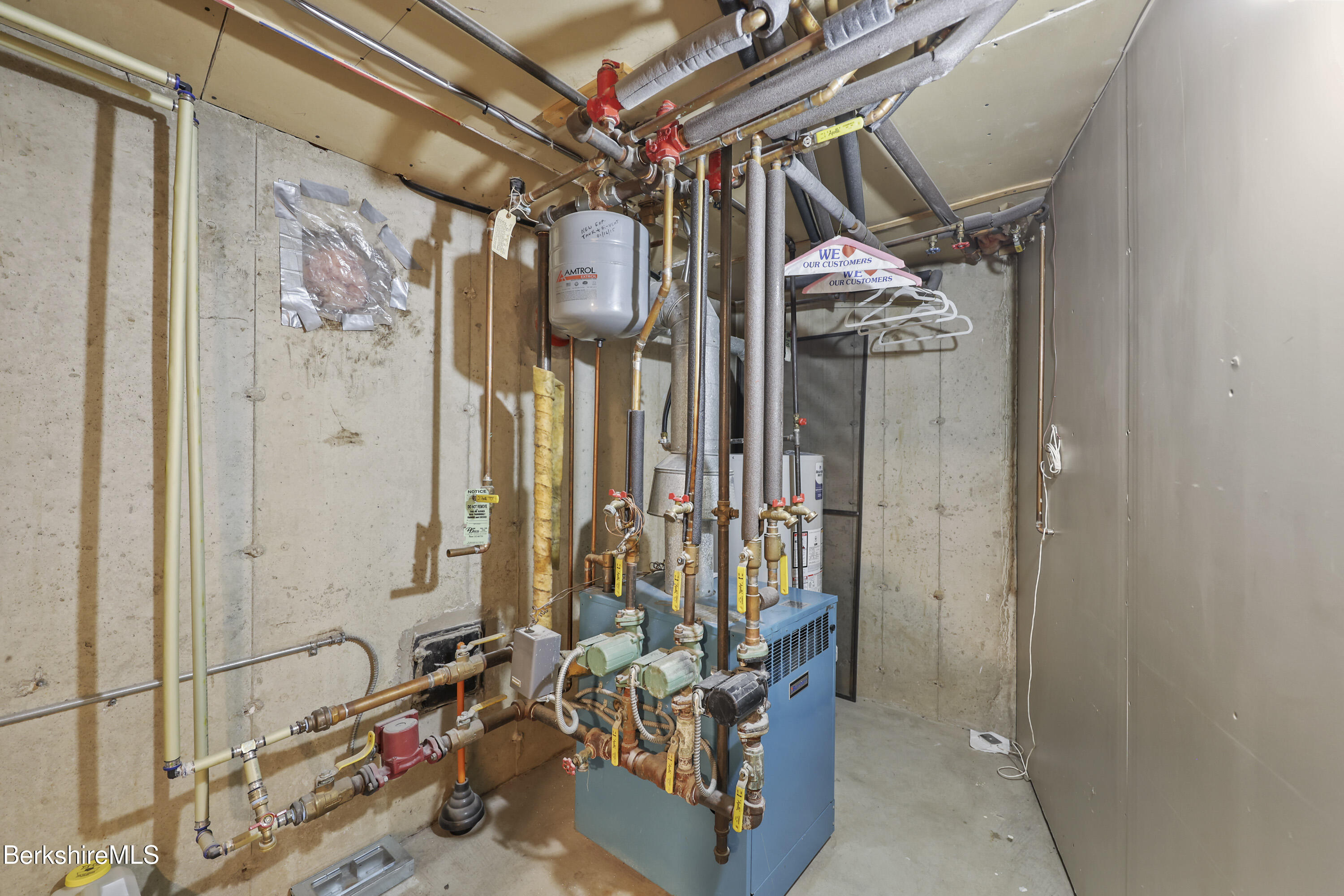 551 Tamarack Road Pittsfield, MA 01201 - Photo 40 of 51 a view of walk in closet with clothes and shoes