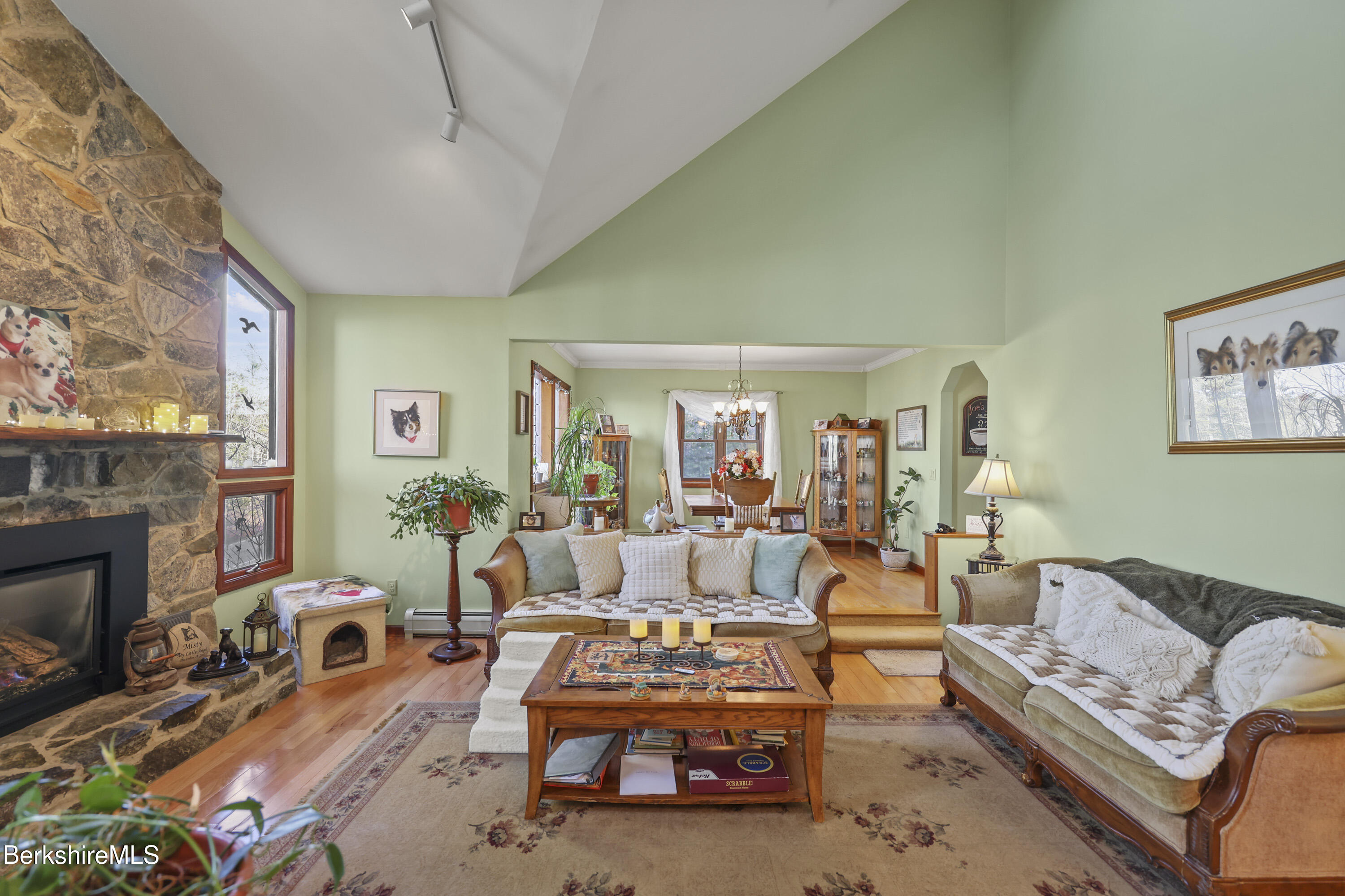 551 Tamarack Road Pittsfield, MA 01201 - Photo 4 of 51 a living room with furniture a fireplace and a large window