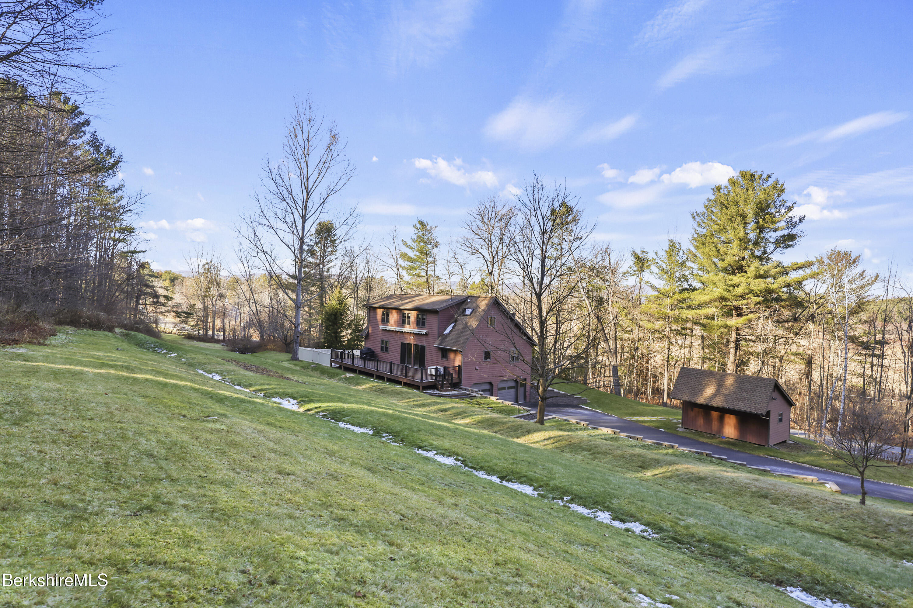 551 Tamarack Road Pittsfield, MA 01201 - Photo 43 of 51 a view of a house with a big yard and large trees